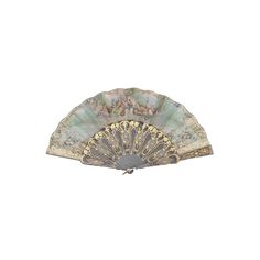 an old fan is sitting on a white surface with gold trimmings and floral designs