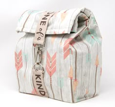 a bag with a name tag on the front and an arrow pattern on the back