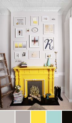 a living room with a yellow fireplace and pictures on the wall