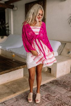 - Set sail in this beautiful crochet tie top! - Hot pink colored crochet material - Loose, three-quarter length sleeves - Open draped silhouette that ends in an uneven hemline perfect for front tie closure Pink Crochet Top For Spring Vacation, Spring Vacation Pink Crochet Top, Pink Crochet Top For Vacation, Pink Crochet Top With Crochet Trim For Vacation, Pink Long Sleeve Crochet Top For Summer, Pink Open Knit Crochet Top For Beach, Pink Open Knit Crochet Top For The Beach, Pink Lace Crochet Top For Beach, Pink Lace Crochet Top For The Beach