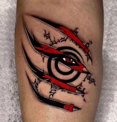 a close up of a person's leg with scissors and stars on it in the shape of an eye