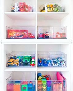 the shelves are filled with plastic containers and toys