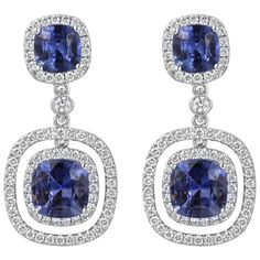 A stunning pair of gemstone dangle earrings showcasing four cushion cut blue sapphires set in four pong setting, surrounded by halo of brilliant round diamonds. Blue sapphires weighs 3.96 carats total and white diamonds weighs 0.76 carats total. Made in 18K White Gold. Roman Malakov is a custom house, specializing in creating anything you can imagine. If you would like to receive a special quote on a custom piece please message or call us. Blue Gemstone Engagement Rings, Beautiful Jewelry Diamonds, Ceylon Blue Sapphire, White Gold Sapphire, Diamond Dangle Earrings, Blue Sapphire Diamond, Bezel Set Diamond, Double Halo, Art Deco Diamond