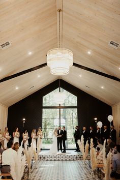 a bride and groom standing at the end of their wedding ceremony