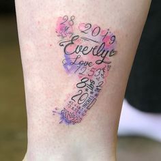 a woman's leg with a tattoo that says everything is love and she has her name written on it