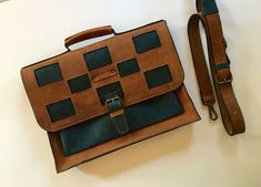 This briefcase is made of two shades of crazy horse leather, brown and blue, which gives an exciting touch to the design, and especially those squares that imitate a chessboard. It can also be worn as a biker bag, or travel bag, it can hold a 13" laptop, documents and just about everything else you can think of, being quite roomy. This unisex bag is perfect for any chess lovers! For custom orders drop me a message. I offer laser engraving for personalization. FEATURES: -double-compartmented inte Handmade Blue Leather Satchel, Handmade Leather Briefcase In Brown, Handmade Brown Leather Briefcase, Handmade Leather Rectangular Briefcase, Handmade Rectangular Leather Briefcase, Men's Briefcase, Chic Crossbody Bag, Laptop Briefcase, Office Bag