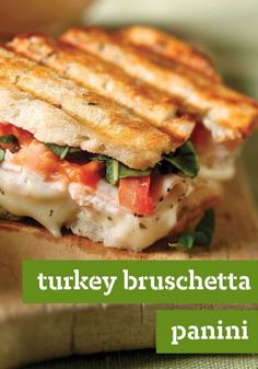 a grilled turkey and cheese panini on a cutting board with the words turkey bruschetta