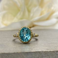 Wow picks! Oval Paraiba Tourmaline And Diamonds Three Stone Ring 14K Yellow Gold Paraiba Twist Band Ring Unique Vintage Paraiba Tourmaline Ring #6154 at $485.00 Choose your wows. 🐕 #DiamondRing #ParaibaRing #VintageParaiba #OvalCut #ParaibaTourmaline #TourmalineRing #TwistBandRing #14kYellowGold #ThreeStoneRing #UniqueRing Tourmaline Jewelry With Halo Setting For Anniversary, Classic Oval Tourmaline Emerald Ring, Oval Sapphire Emerald Ring As Birthstone, Heirloom Oval Topaz Ring With Halo Setting, Oval Tourmaline Gemstones With Accent Stones, Oval Sapphire Ring May Birthstone Fine Jewelry, Gold Tourmaline Ring In Fine Jewelry Style, Formal Sapphire Ring With Accent Stones For May Birthstone, Oval Tourmaline Halo Setting Jewelry