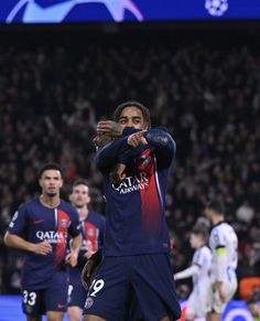 the soccer players are applauding each other on the field