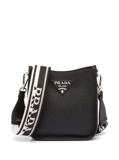 mini logo-embellished shoulder bag from PRADA featuring black, leather, grained texture, silver-tone logo lettering, concealed magnetic fastening, interchangeable strap and internal patch pocket. | Prada Mini Logo-Embellished Shoulder Bag Prada Mini, Mini Envelopes, Mini Logos, Mini Pouches, Prada Leather, Shoulder Bag Black, Mini Shoulder Bag, Leather Mini, Prada Bag