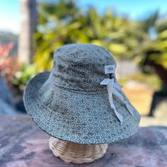 A wide brim sun hat for sunny days and outdoor fun.  This sun hat for women has a nice wide brim to protect your whole face and even your neck and chest. A drawstring around the head keeps the hat fitting snug.  Easy to bring along in your bag, folds up easy.   This hat is made from a medium weight cotton fabric in a sage green floral mosaic pattern.  Inside liner is white cotton.  I used a stiff interfacing for the brim to keep it's shape. Brim measures 4.5" Crown depth is 3.5". Contact me for Uv Protection Wide Brim Sun Hat, Adjustable Wide Brim Bucket Hat With Upf 50+, Packable Wide Brim Bucket Hat, Adjustable Wide Brim Bucket Hat With Uv Protection, Packable Bucket Sun Hat, Packable Adjustable Bucket Sun Hat, Wide Brim Upf 50+ Bucket Hat For Warm Weather, Casual Sun Hat With Upf 50+ For Picnic, Bohemian Outdoor Hats With Upf 50+