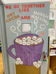 a door decorated to look like a hot cocoa and marshmallows