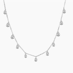 Adorn your neckline with elegance in our Cubic Zirconia Necklace in Sterling Silver. Embellished with several CZ stones, this necklace exudes stunning brilliance. Perfect for showcasing your chic clavicle, it adds a touch of glamour to any ensemble. Zirconia Necklace, Studded Necklace, Cubic Zirconia Necklace, Cubic Zirconia Jewelry, Moissanite Jewelry, Layered Jewelry, Shop Engagement Rings, Cz Stone, Pendant Earrings