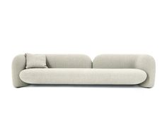 a white couch with two pillows on it's back and the seat upholstered