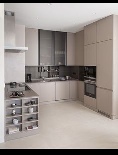 a modern kitchen with stainless steel appliances and cabinets