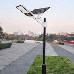 a solar powered street light on the side of a road