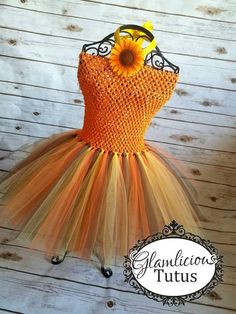 Hello and welcome to my etsy store! PLEASE READ ENTIRE LISTING What you are buying is a brand new hand made tutu Dress! The tutu dress is on an Orange crochet top. The skirt of the dress is Orange, Yellow, and Brown The tutu ties as a halter in the back with a yellow grosgrain ribbon. The tutu has an attached felt sunflower on the top attached the the halter tie. These are PERFECT for Holidays, photo shoots, and dress up! **SIZE CHART IN PHOTO SECTION! ** ASK ABOUT BULK ORDERS! Please allow 1-7 Fall Tutu Dress, Thanksgiving Tutu, Fall Tutu, Felt Sunflower, Pageant Wear, Orange Crochet, Market Ideas, Dress Autumn, Newborn Dresses