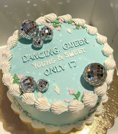 a cake with disco balls on it and the words dancing queen young & sheet only 17