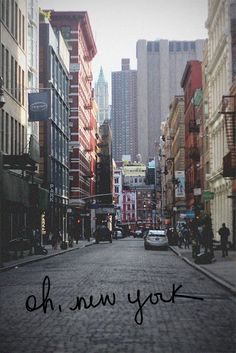 an image of a city street with cars and buildings in the background that says oh, new york