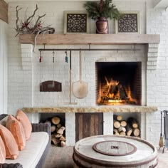 a living room filled with furniture and a fire place