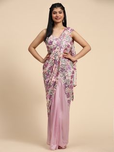 Make a style statement with this stunning pink sequins net party wear a pre-stitched half saree with a matching blouse. The floral sequin work adds a touch of elegance and glamour to the outfit, making it perfect for parties, festivals, and receptions.
The saree and blouse come fully stitched and ready to wear in sizes S to M, giving you the perfect fit without any hassle. Crafted from high-quality net and satin fabrics, this designer saree exudes sophistication and charm.
The intricate floral sequin work further enhances the beauty of the outfit, making it a must-have for any fashion-forward woman. The 5.50 meters saree drapes beautifully, while the matching blouse complements the overall look with its similar sequin detailing. Bollywood Designer Sarees, Designer Bridal Lehenga Choli, Net Blouse, Engagement Reception