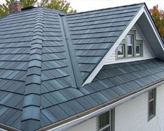 a house with a metal roof in the fall