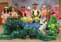 a group of people in costumes posing for a photo