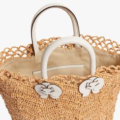 Timeless and posh, Pamela Munson’s straw accessories are beloved by island hoppers and city dwellers alike. Her bags reinterpret straw as a natural, sustainable material that can be worn any season, anywhere. The Mimi in White is a romantic update to your everyday tote. This new silhouette blends timeless style with a feminine touch. The crochet raffia makes for a beautiful, lace-like effect while the croc-embossed leather top handles with orchid detail allow for a fresh statement. Product Detai Pamela Munson, Straw Accessories, Everyday Tote, Leather Top, Timeless Style, Embossed Leather, Timeless Fashion, Straw, Handles