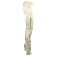 This pair of white Gucci pants, designed by Tom Ford for the Fall/Winter 2004 collection, features a form-fitting silhouette with ruching at the calves and a monochrome striped ribbon on either side. Never worn and complete with the original brand tags still attached, these fabulous Gucci by Tom Ford pants are part of Ford's final collection at Gucci. Approximate measurements: Size - IT40 Waist: 30" Hips: 36” Inseam: 36” 78% viscose, 22% silk Gucci Fitted Designer Pants, Tom Ford Pants, Tom Ford For Gucci, Gucci By Tom Ford, Gucci Pants, Striped Ribbon, Ribbon Trim, Brand Tags, White Satin