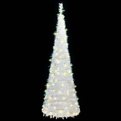 a large white christmas tree with lights on it