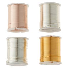 four spools of wire on white background