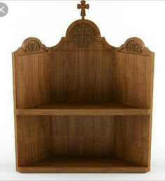 a wooden shelf with a cross on the top and two shelves below it that are made out of wood