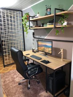 a desk with a computer monitor and keyboard on it