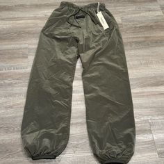 Essentials Fear Of God Ink Trackpants Sweatpants Nwt Msrp $130 Men’s Size: Xs Brand New Never Worn With Tags Accepting Offers Khaki Athleisure Bottoms For Streetwear, Sporty Khaki Pants For Fall, Sporty Khaki Full-length Pants, Sporty Khaki Pants, Sporty Full Length Khaki Pants, Sporty Khaki Tapered Leg Bottoms, Khaki Athleisure Pants For Streetwear, Sporty Khaki Trousers, Sporty Straight Leg Khaki Pants