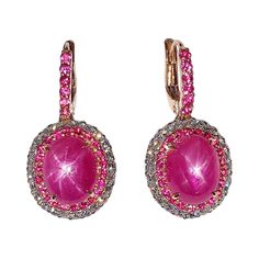 Star Ruby 8.01 carats with Pink Sapphire 0.80 carat and Diamond 0.70 carat Earrings set in 18 Karat Rose Gold Settings Width: 1.3 cm Length: 2.5 cm Total Weight: 8.46 grams "We first opened doors in 1980 when it was then situated in the vicinity of the Victory Monument; a small and modest storefront with a couple of counters. From its humble beginnings to where it stands today, our company has proven its abilities as a jeweler. Since the beginning, we have been supplying fine quality pieces to d Sapphire And Diamond Earrings, Gold For Sale, Ruby Earrings, Star Ruby, Dream Jewelry, Sapphire Diamond, Gold Stars, Pendant Set, Pink Sapphire