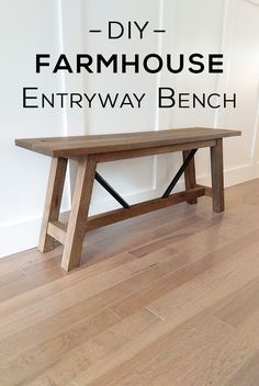 a wooden bench sitting on top of a hard wood floor