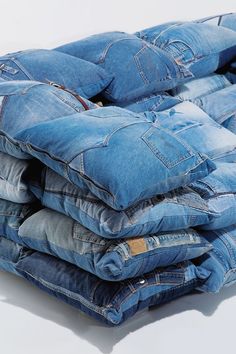 a pile of jeans sitting on top of each other