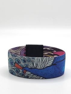 Graceful peacock will bring you more :) Do you need a reminder? Would you like to carry an art piece on your wrist? Or just a stylish, unique piece that will complete your look. Our reversible and soft elastic wristbands are a unique trendy gift choice for any occasion. The woven material is light and durable and also comfortable to wear all day. Most of the designs come in 4 sizes. Please check the available size options in our products listings. SMALL    :  Fits Wrists 3.4" to 5.3" / 160mm MEDIUM :  Fits Wrists 4.3" to 6.9" / 175mm LARGE    :  Fits Wrists 5.3" to 7.6" /  190mm KIDS        :  Fits Wrists 3.5" to 5.2" / 145mm Some of our designs come with a magnet piece that shows a segment of the design. We are located in Atlanta; all orders will ship in 1-2 business days. We are using US Adjustable Multicolor Cuff Bracelet As Gift, Artistic Adjustable Bracelets As Gift, Artistic Adjustable Bracelets For Gifts, Artistic Adjustable Bracelets As A Gift, Multicolor Wearable Art Bracelets For Festival, Multicolor Wearable Art Bracelet For Gift, Adjustable Multicolor Cuff Bracelet Gift, Artsy Multicolor Bracelets For Gifts, Artistic Adjustable Multicolor Bracelets