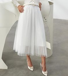 Look your best in the Prestigious Tulle Pleated Flowy Maxi Skirt. This lightweight and comfortable skirt is crafted from soft tulle that is pleated for maximum comfort. Its flowy skirt design adds a touch of class and elegance to your wardrobe. Perfect for formal occasions or everyday wear. 100% Polyester Imported Elegant pleated design: This pleated skirt features a beautiful pleated design that creates a flowing, elegant silhouette. The pleats are evenly spaced and give the skirt a luxurious t Flowy Maxi Skirt, Comfortable Skirts, Flowy Maxi Skirts, Winter Knit Hats, Soft Tulle, Black Sparkle, Touch Of Class, Flowy Skirt, Look Your Best