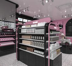 the interior of a cosmetics store with pink and black shelves