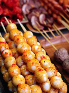 several skewers of food sitting on top of a table