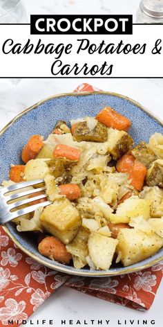 a blue bowl filled with potatoes and carrots next to a fork on top of a napkin