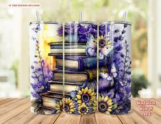 three purple books with butterflies and flowers on them are stacked in front of each other