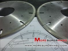 two metal discs sitting on top of a piece of paper with the words moresuperhard