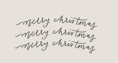 the words merry christmas are written in cursive writing on a gray background with black ink