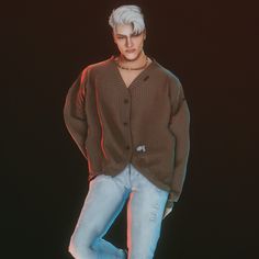 a male in a brown sweater and blue jeans