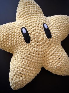 a knitted starfish with two eyes on it