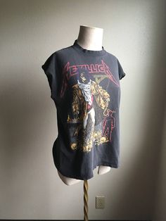 "1992 Official Metallica I Dub The Unforgiven t-shirt 100% cotton made in USA good vintage condition worn in/loved in cut off sleeves with some nice bleach stains/fade/ seed size holes labeled size L measures, lying flat, shoulder- 21\" chest- 22\" length- 26\" image by artist Pushead heavy metal parking lot flex" Streetwear Cotton Muscle Tee With Screen Print, Cotton Muscle Tee With Screen Print For Streetwear, Vintage Muscle Tee With Crew Neck For Streetwear, Distressed Crew Neck Muscle Tee For Streetwear, Vintage Graphic Print Muscle Tee With Crew Neck, Vintage Cotton Muscle Tee With Graphic Print, Band Merch Cotton Muscle Tee For Streetwear, Vintage Cotton Muscle Tee With Crew Neck, Screen Print Muscle Tee With Short Sleeves For Streetwear