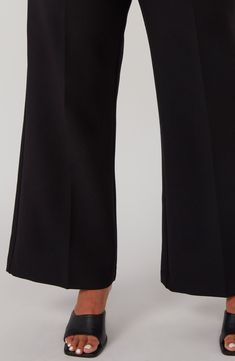 Achieve desk-to-dinner perfection in these sophisticated stretch trousers designed with a fabulous high waist and floor-sweeping wide legs. 30 1/2" inseam; 26 1/2" leg opening; 13" front rise; 18" back rise Zip fly with hook-and-bar closure 72% polyester, 24% viscose, 4% elastane with 100% polyester contrast Machine wash, line dry Imported Formal Stretch Wide Leg Dress Pants, Formal Wide Leg Dress Pants, Tailored Wide Leg Pants For Night Out, Sleek Business Casual Wide Leg Pantsuit, Wide Leg Stretch Pantsuit For Office, Stretch Wide Leg Pantsuit For Office, Stretch Wide Leg Pants For Formal Occasions, Stretch Wide Leg Pants For Office, Sleek Wide Leg Dress Pants For Office