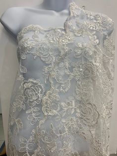 the back of a dress with white lace on it